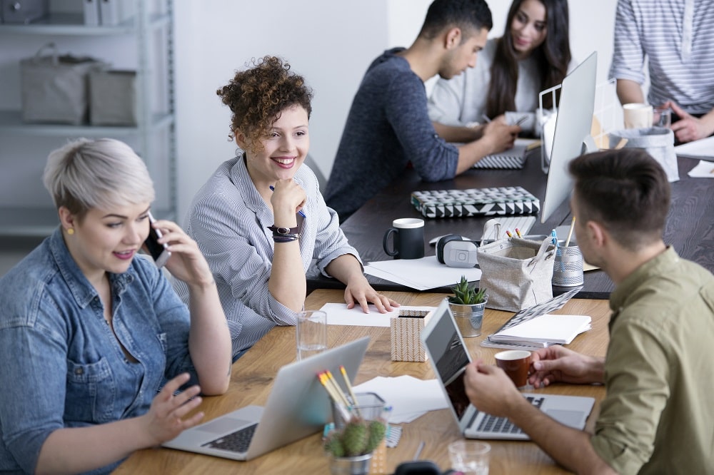 What all is required in creating a vibrant atmosphere at the workplace?